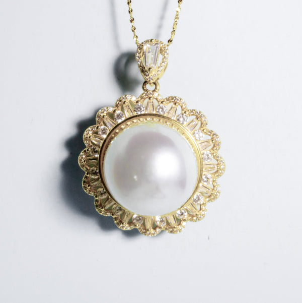 Radiant Crown pendant featuring 16.3mm round white South Sea pearl in gold-plated crown setting from GRACE SELECTED