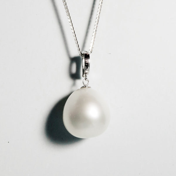 Drop South Sea pearl with luminous surface and clean finish in minimalist white gold setting
