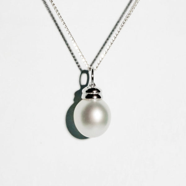 Dawn Light pendant with 11mm oval white South Sea pearl in minimalist silver setting from GRACE SELECTED