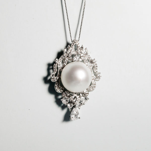 White South Sea pearl with radiant lustre set in baroque-inspired 925 silver with zircon stones