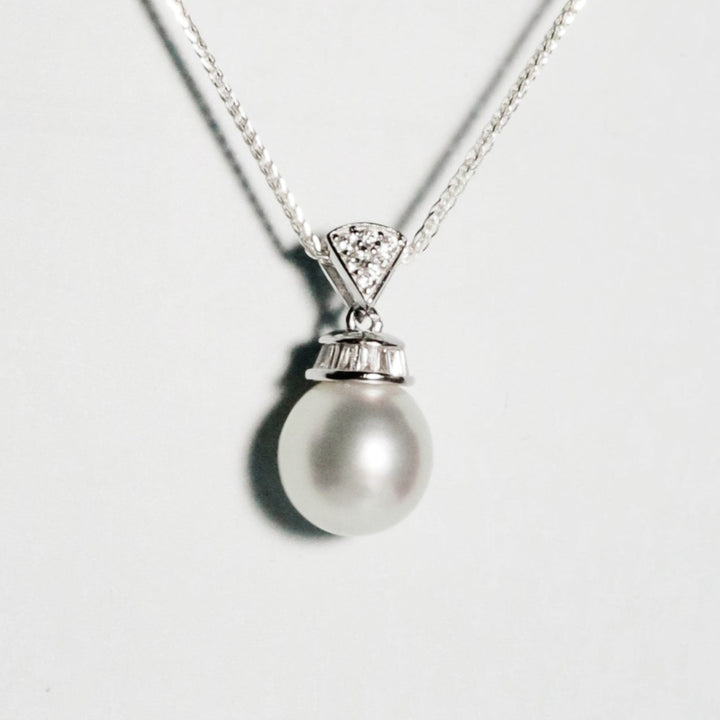 Petite South Sea pearl with luminous lustre and clean surface in silver crown setting with zirconia