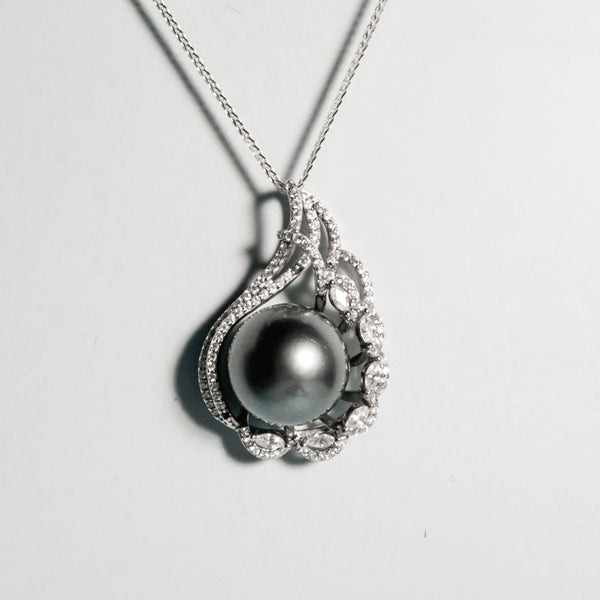 12mm black Tahitian pearl with smooth surface and subtle lustre in an elegant silver pendant